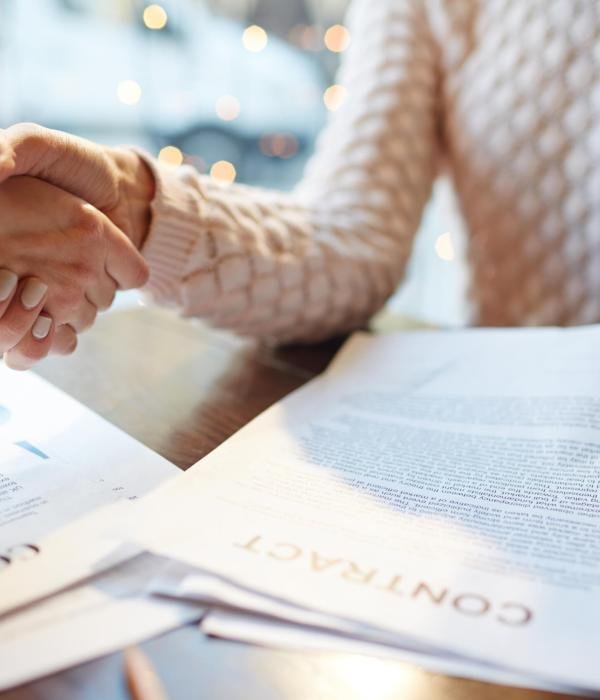 Humans striking insurance deal and handshaking